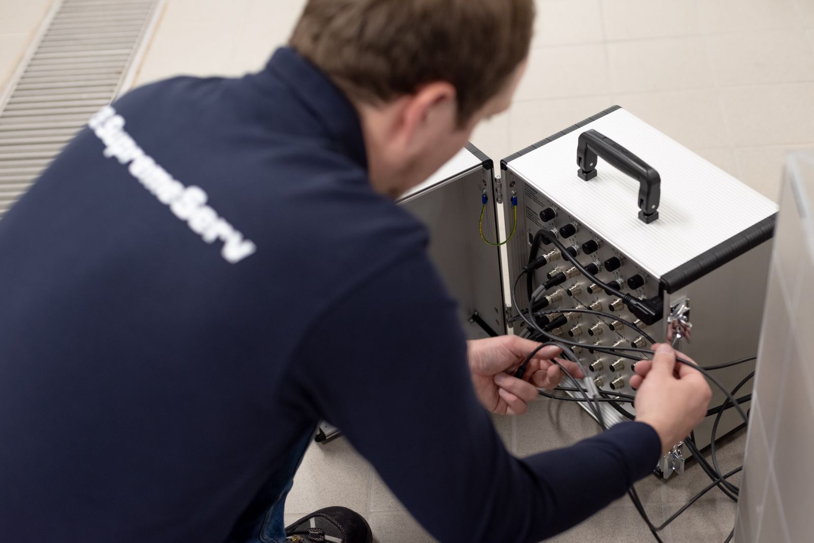 A technician performing SES pump data analysis